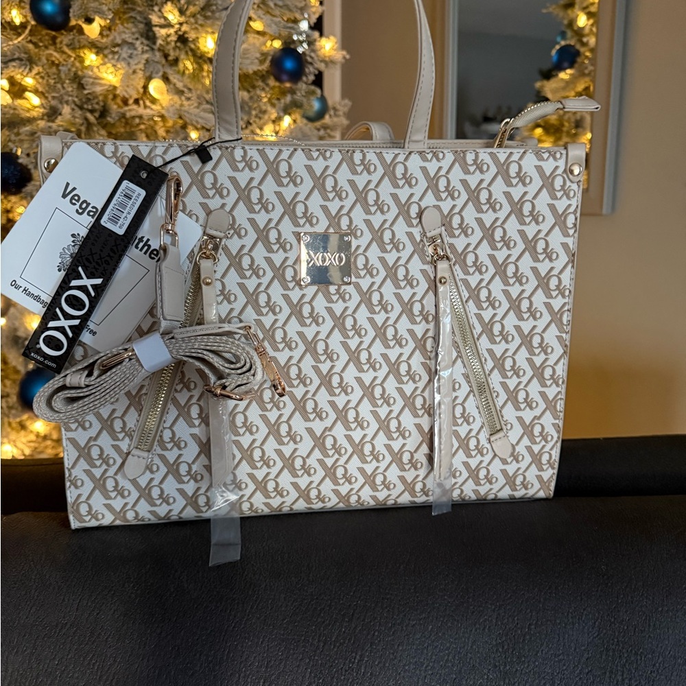 XOXO Cream and Gold Satchel with Elegant Design.